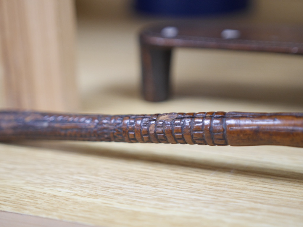 A Fijian throwing club, ula, and Fijian Kava oil bowl with mother of pearl inlay, largest 38cm in length. Condition - good